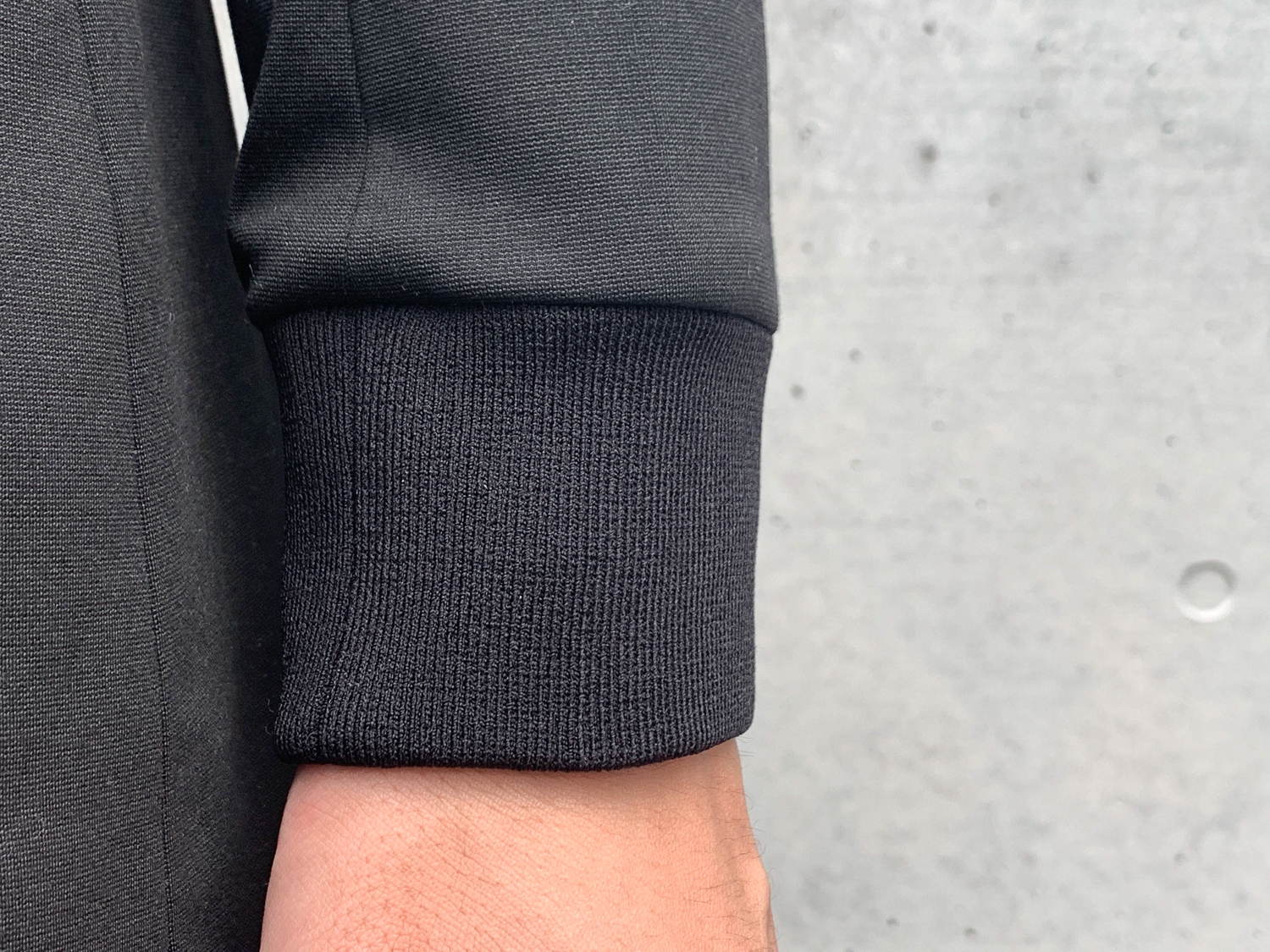 A black cuff that compliments an all black suit.