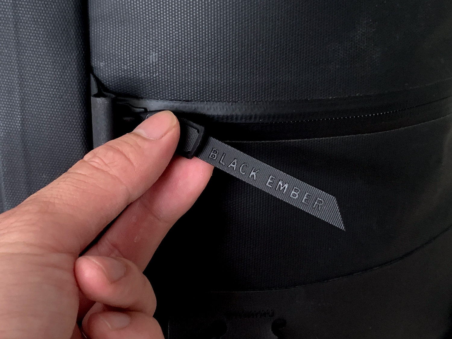 Black Ember takes the black minimalist backpack to the next level with black-on-black branding on the zipper pulls.