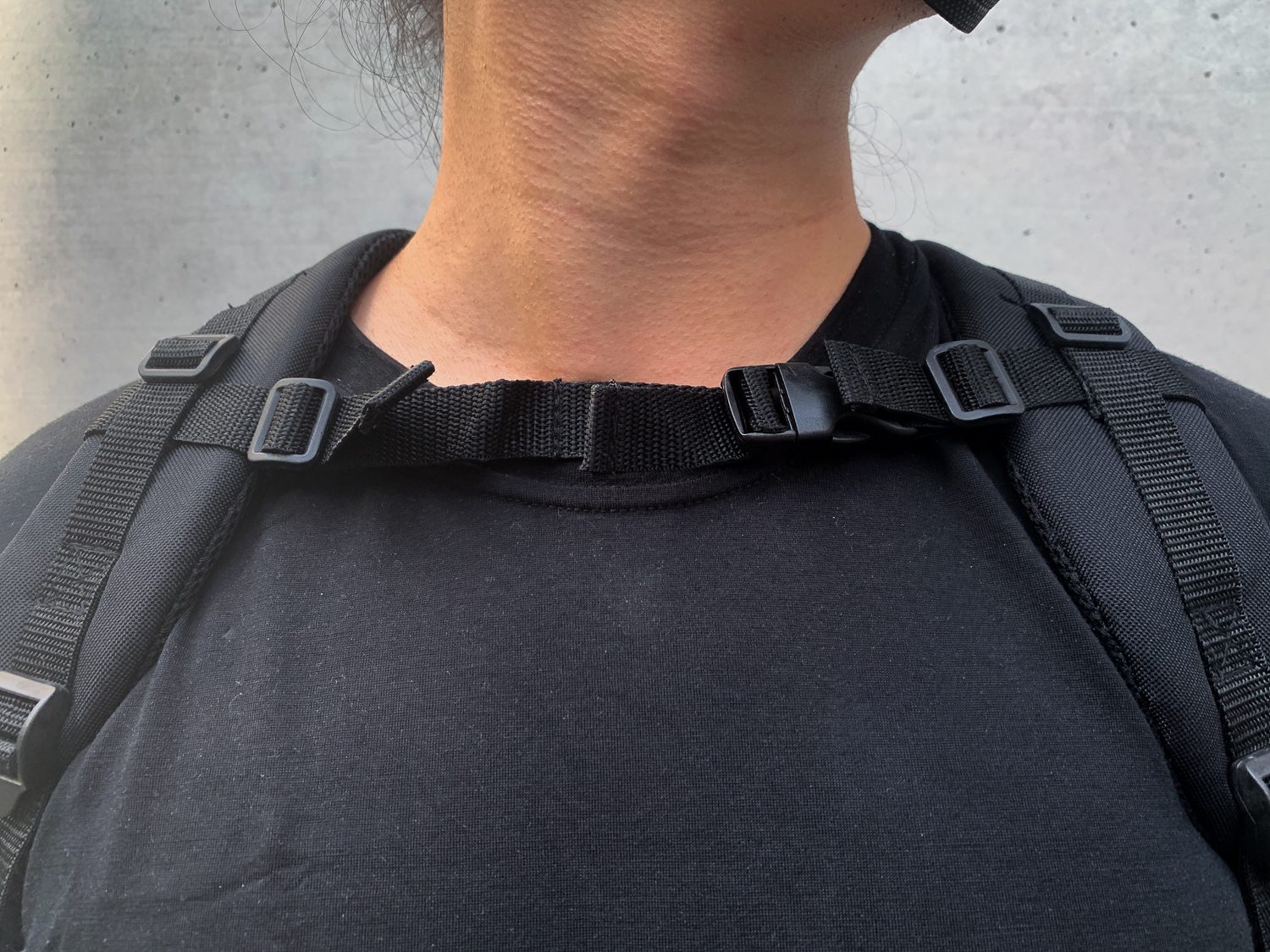 If you wear the straps too loose, the sternum strap comes up to your neck, which is typical for military backpacks which are designed for stability with heavy loads.