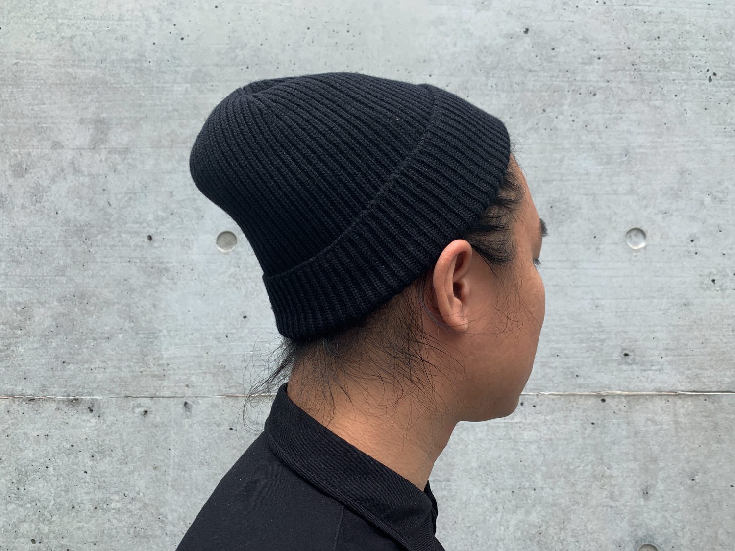 A wool watch cap that is sized enough fits your head, but not too loose that it comes out easily.