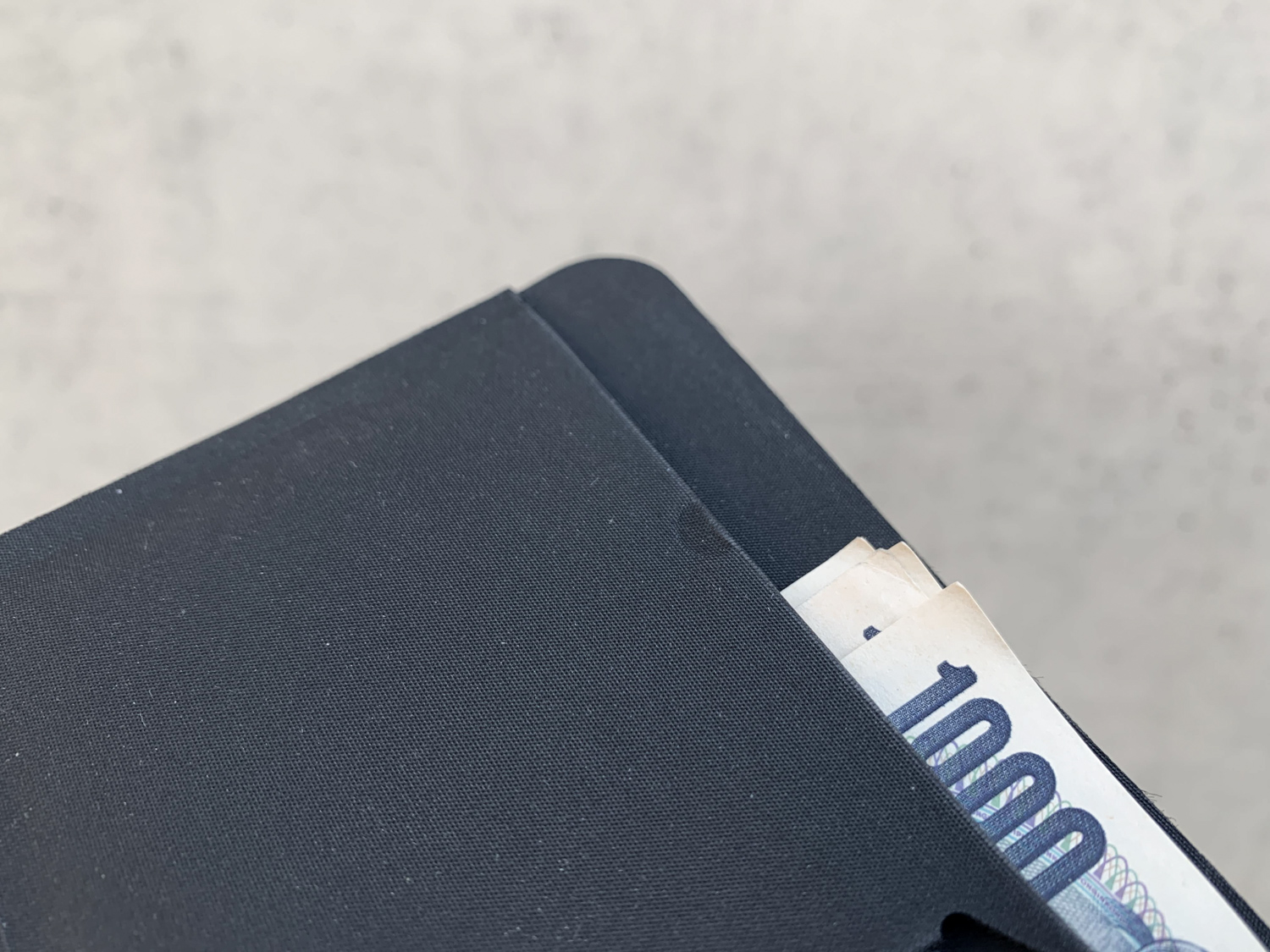 A bifold wallet that can hold an air ticket.