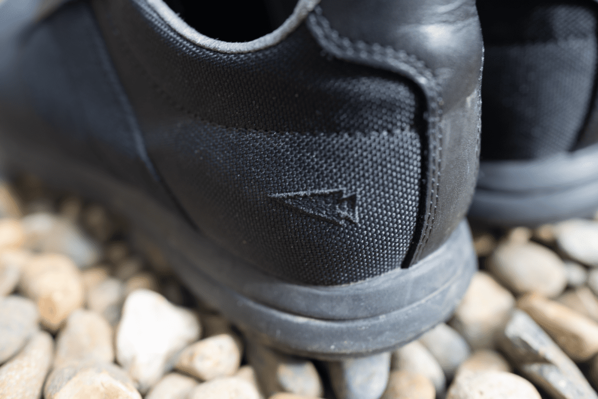 Subtle embroidered arrowhead logo on the GORUCK I/O Cross Trainers.