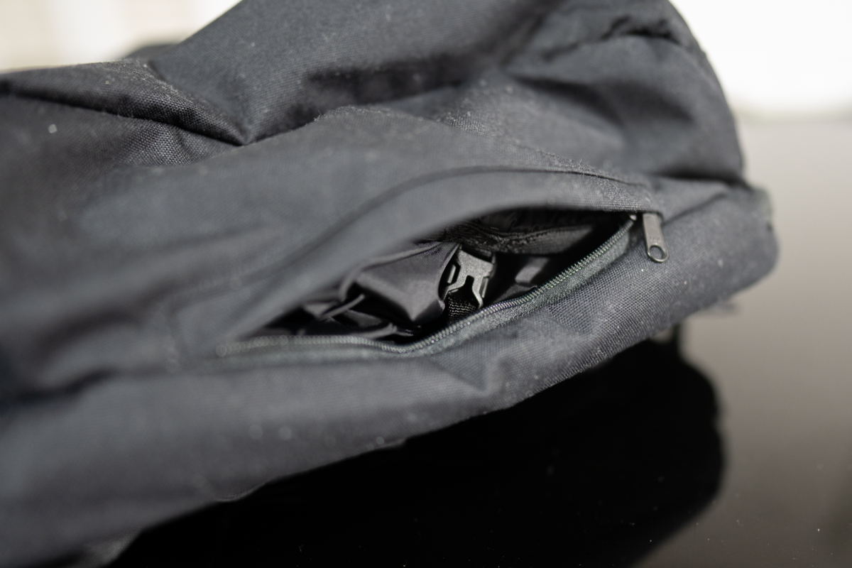 A dedicated slot for the rain cover below the Minaal Daily Bag.