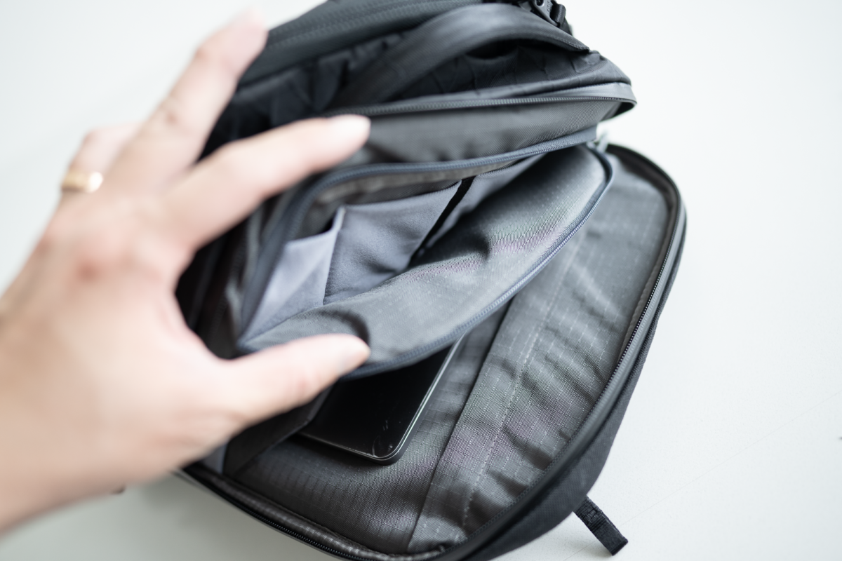 This compartment on the Able Carry Max Backpack has four stretch dividers.