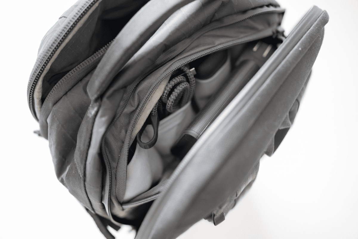 This compartment on the Able Carry Max Backpack is great as a tech pouch.