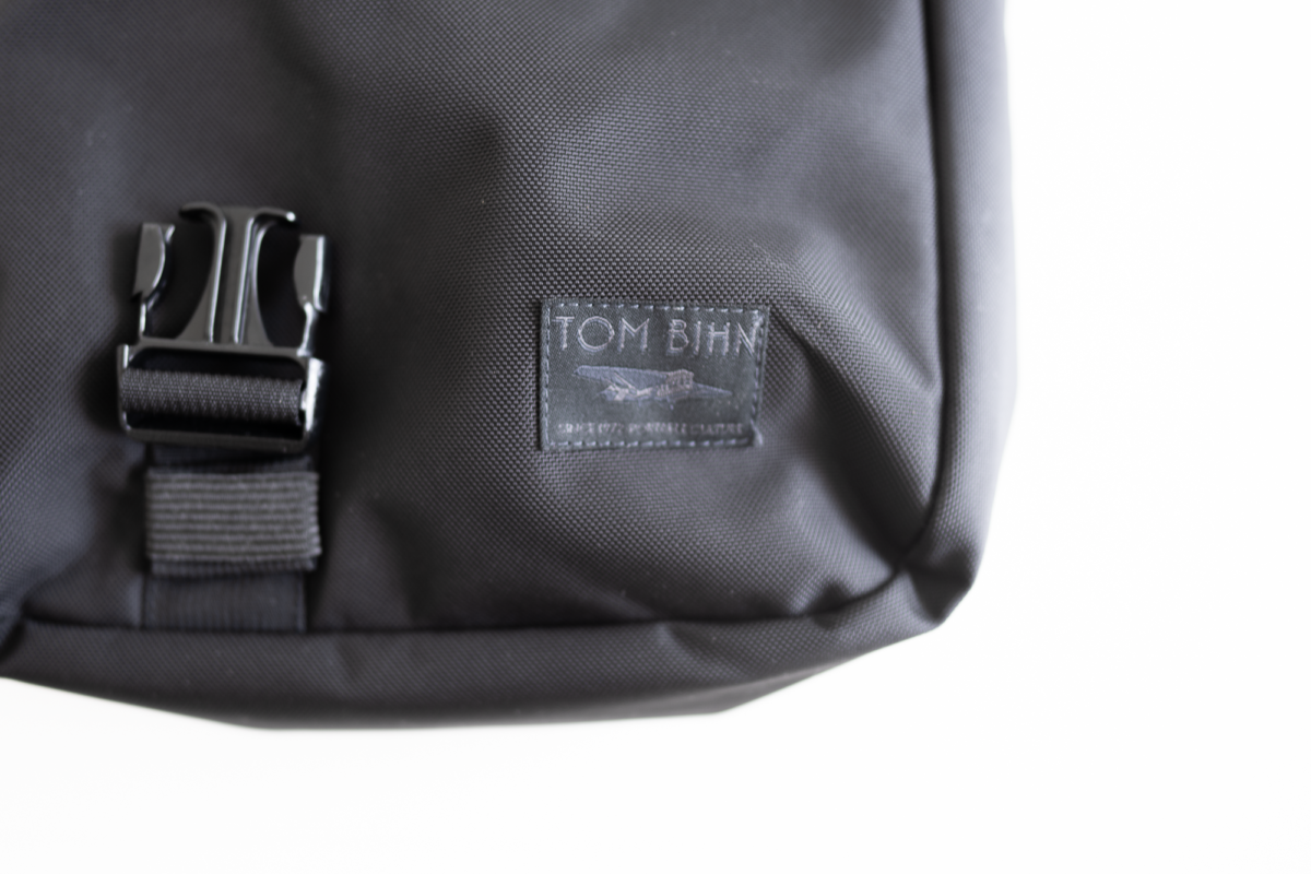 Brand tag of the TOM BIHN Cafe Bag.