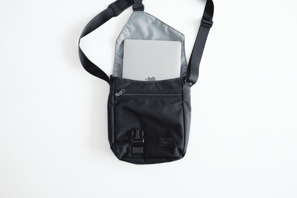 The TOM BIHN Cafe Bag (medium) fits a 13-inch Macbook Pro well.