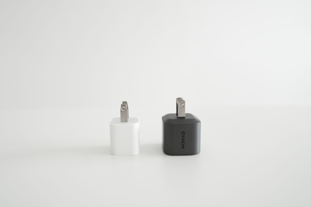 The NOMAD 20W Power Adapter side-by-side with the Apple 5W Power Adapter.